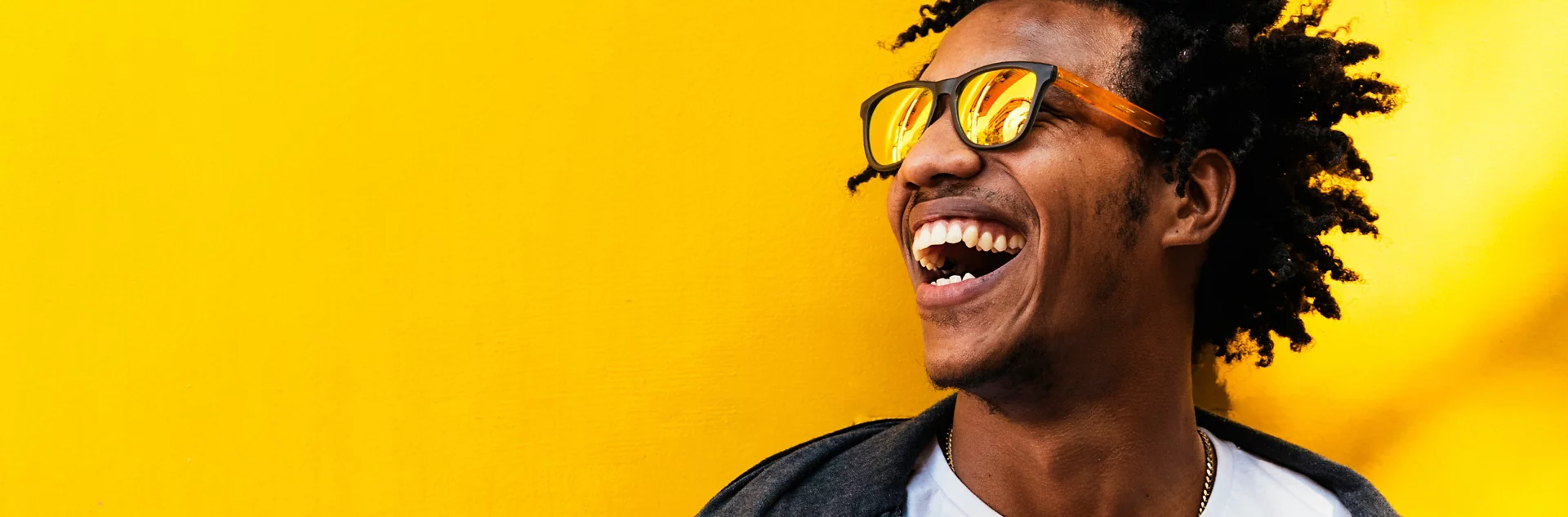 Man With Sunglasses Smiling Yellow Background