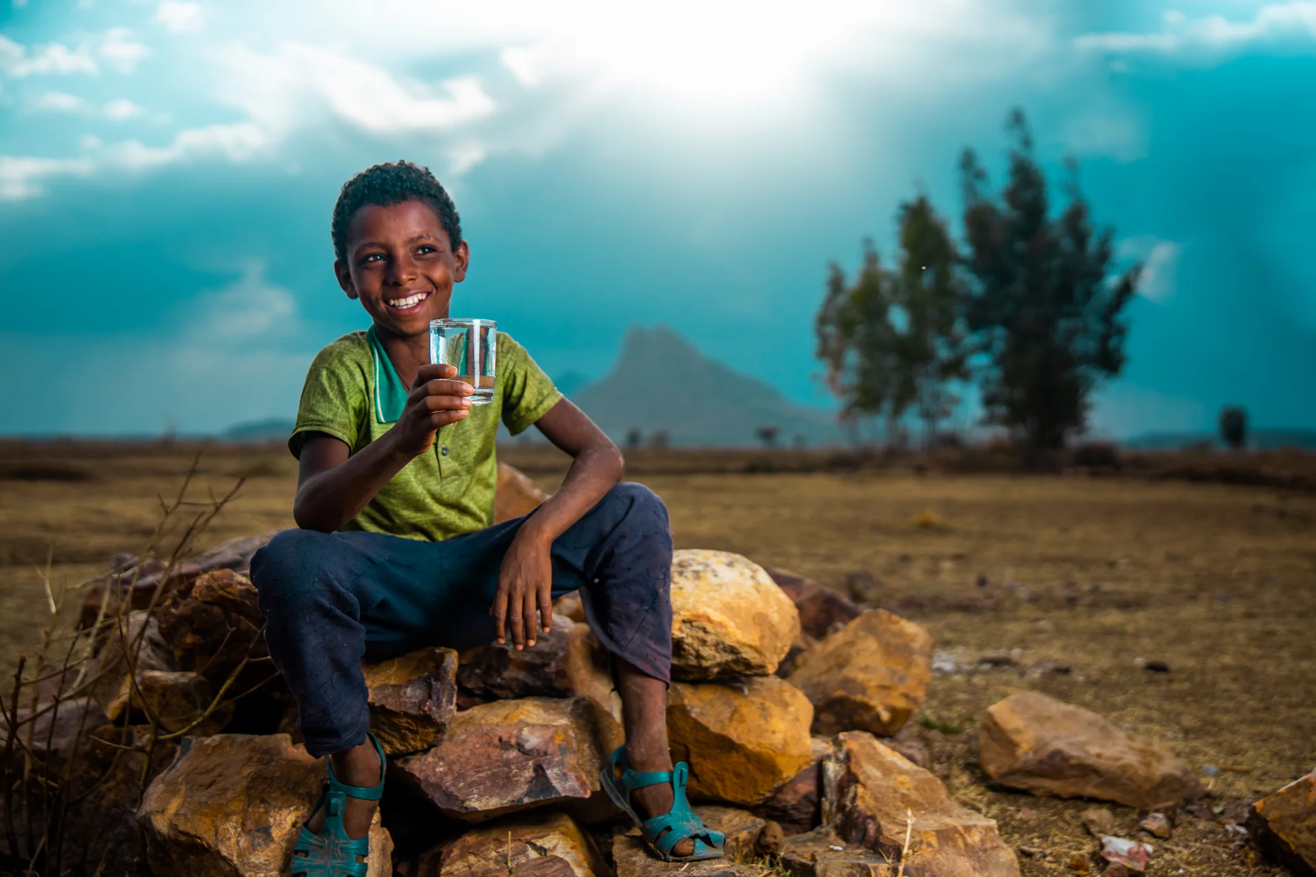 Image of a kid drinking clean water in Ethiopia