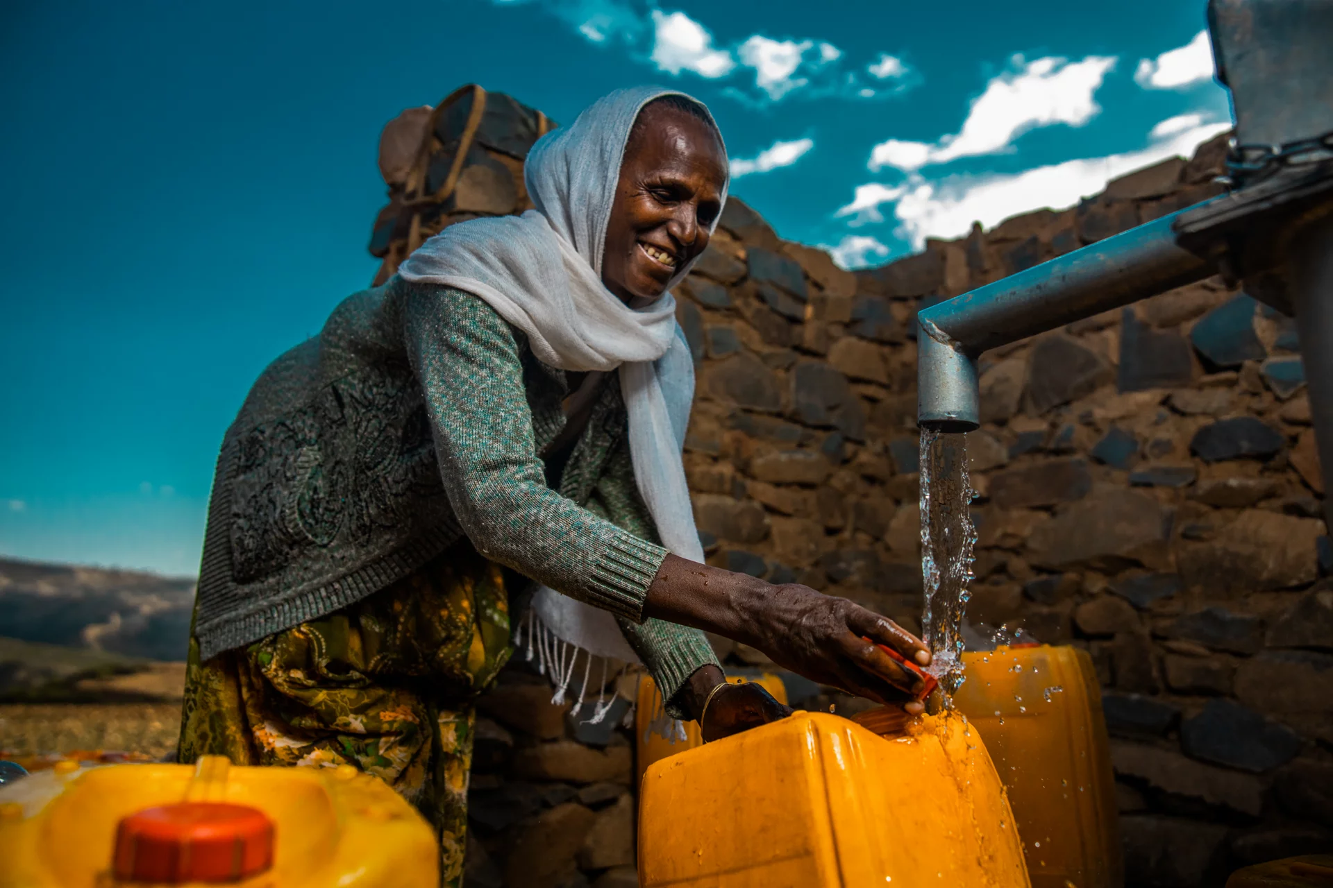 Image of an individual with clean water in Ethiopia
