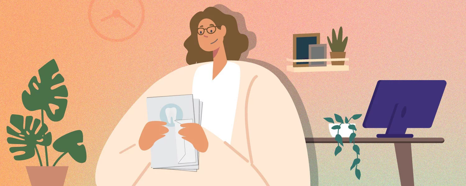 Woman looking at dental papers in room