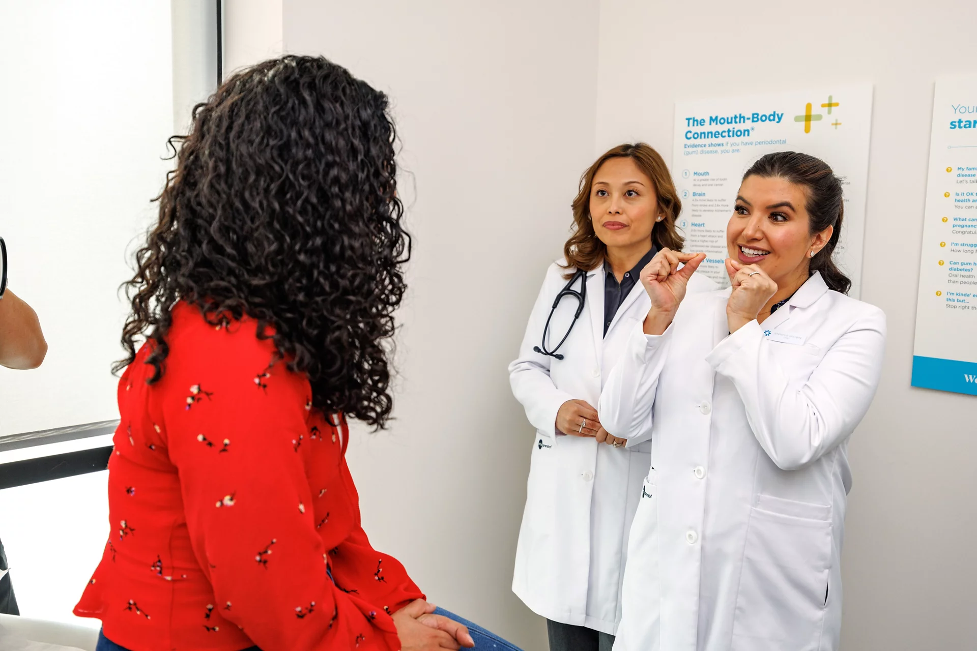 Doctors meeting with patient