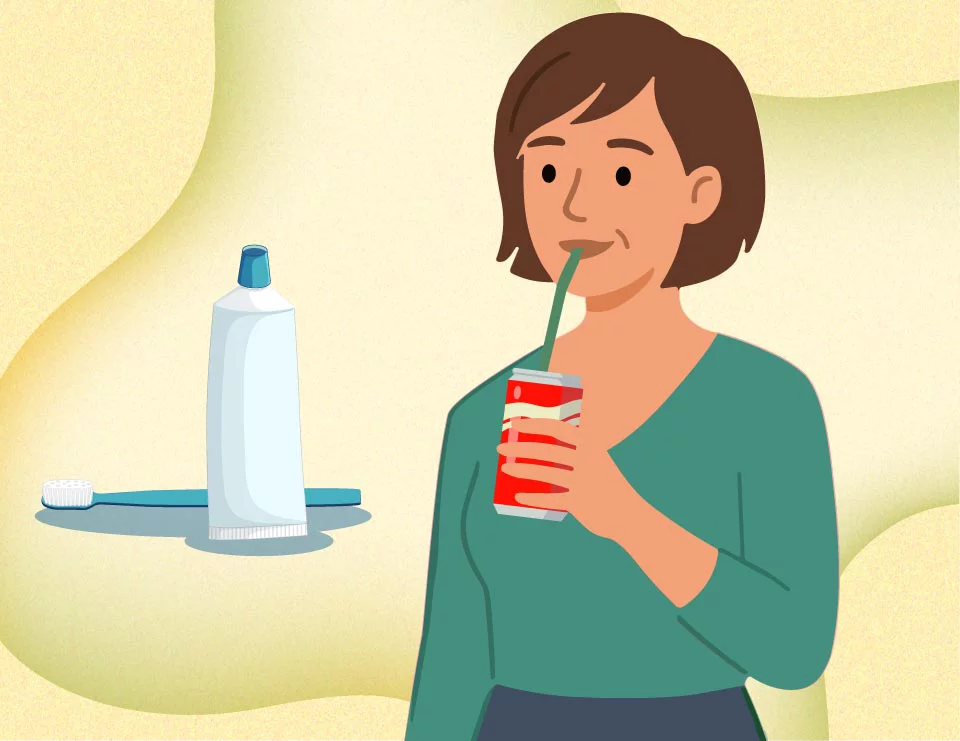 woman drinking soda, with toothbrush and toothpaste next to them