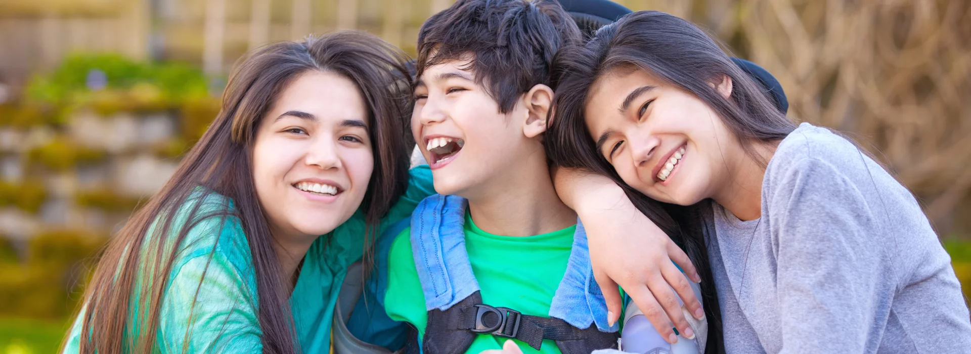 Three friends smiling together