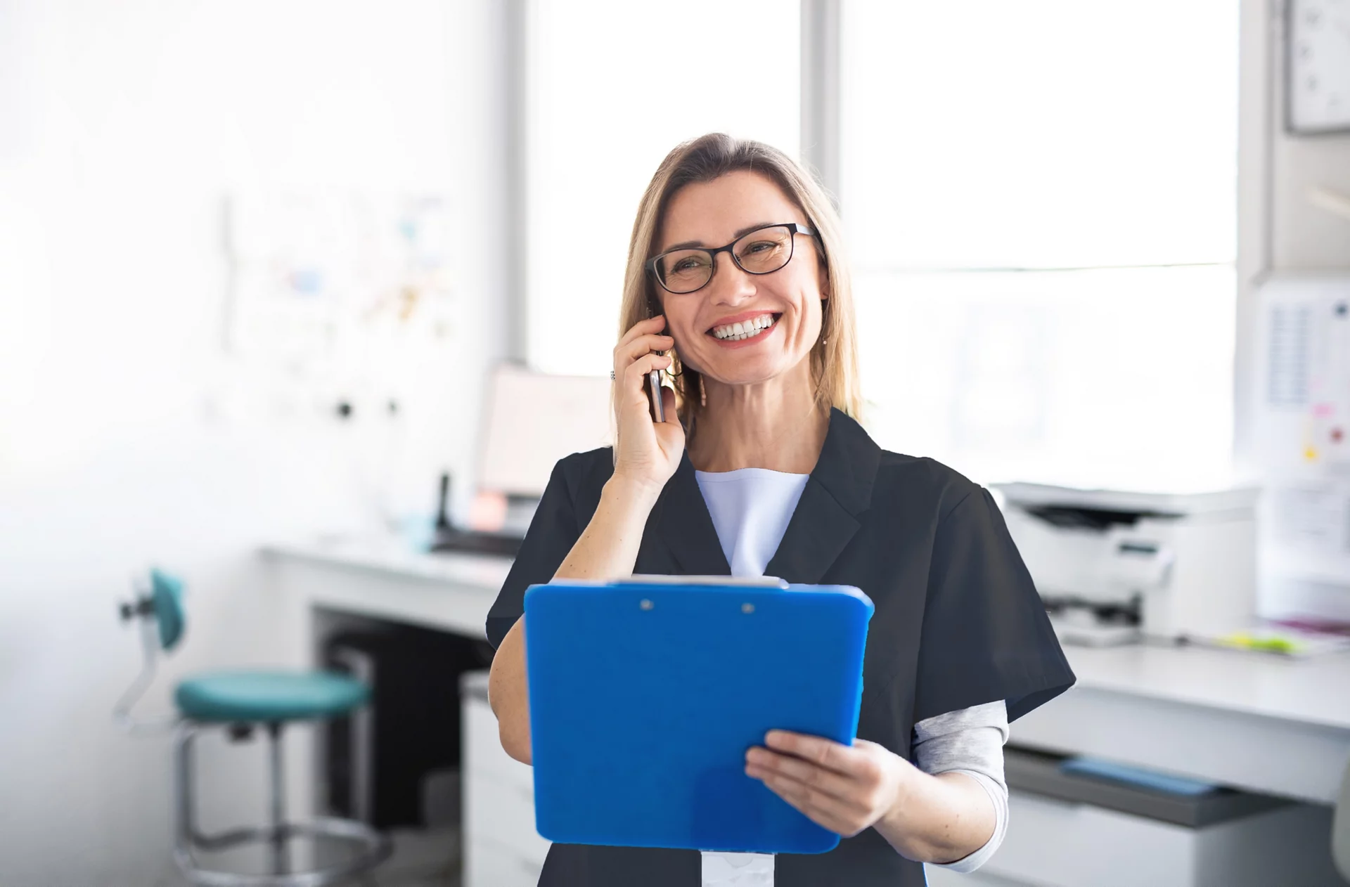 Female dentist on the phone
