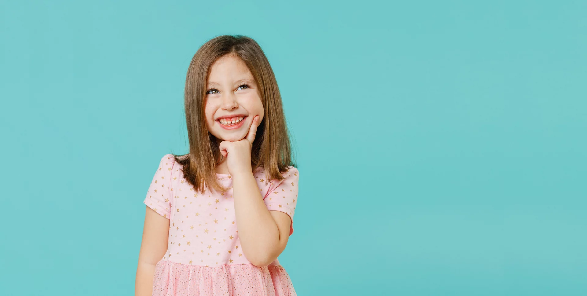 Little fun cute kid girl 5-6 years old wears pink dress prop up on chin think dream isolated on pastel blue color background child studio portrait. Mother's Day love family people lifestyle concept.