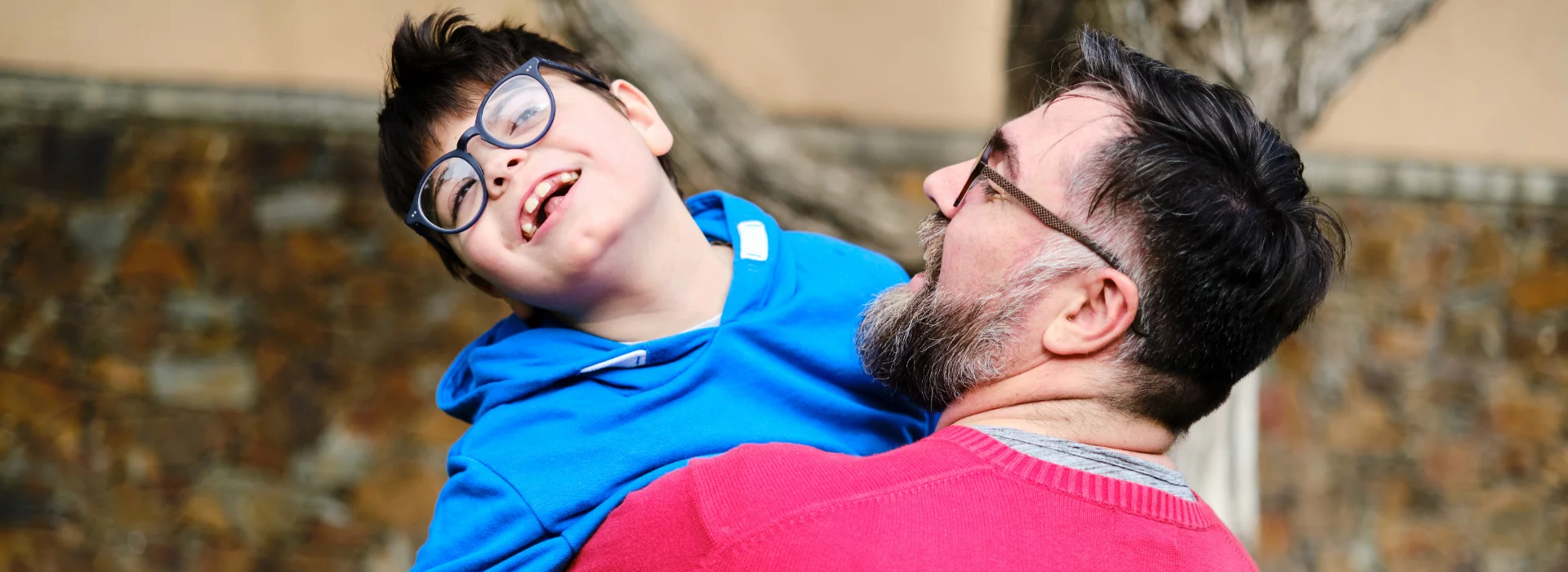 Man with boy having fun