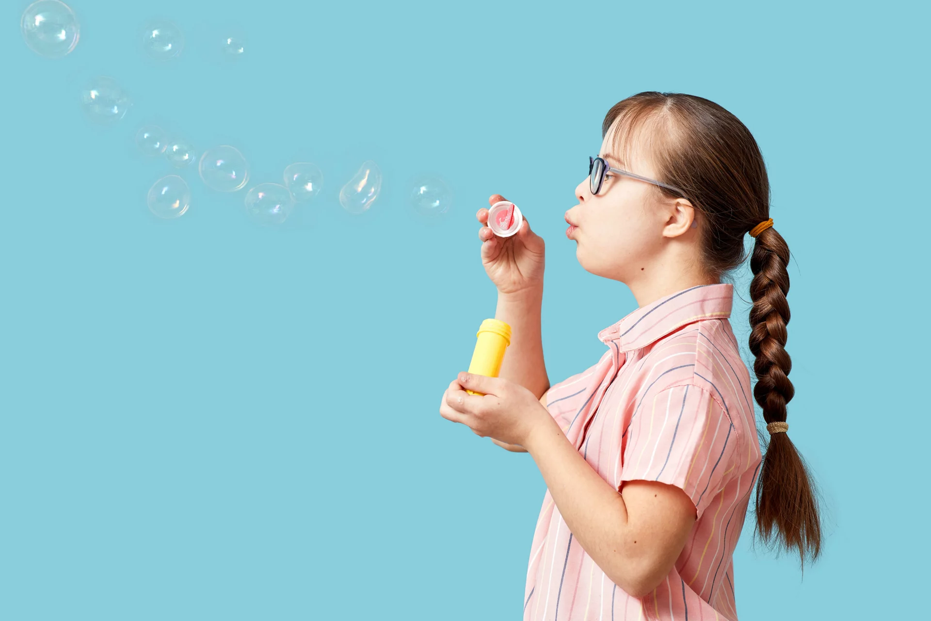 Girl blowing bubbles