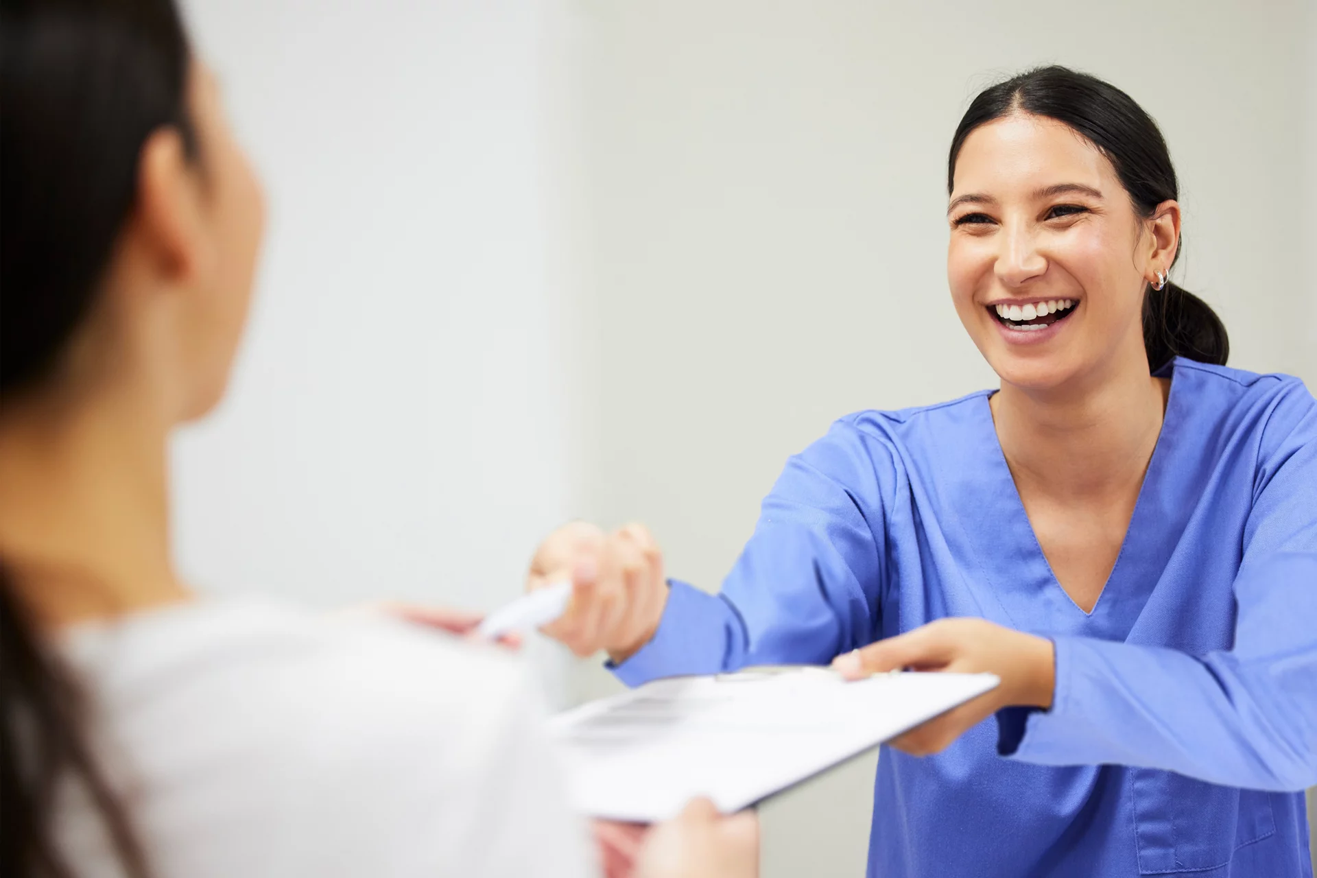 dental provider working with her patient