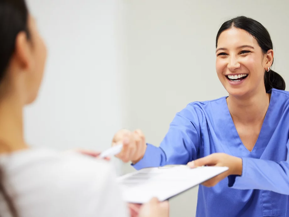 dental health coordinator sharing document with patient