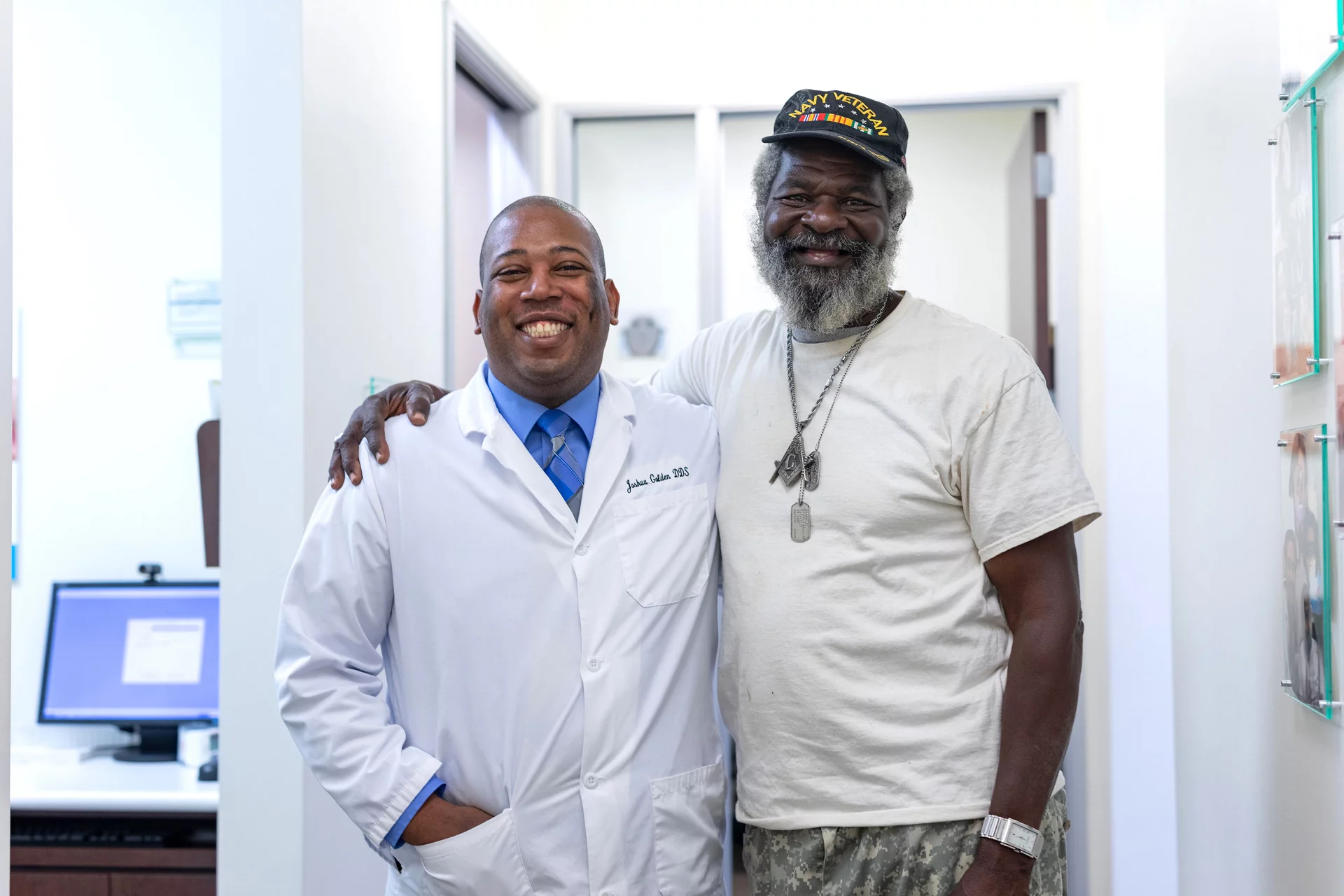 dentist hugging patient at dental office