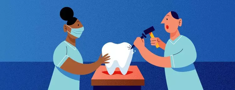 Two people chipping at a tooth