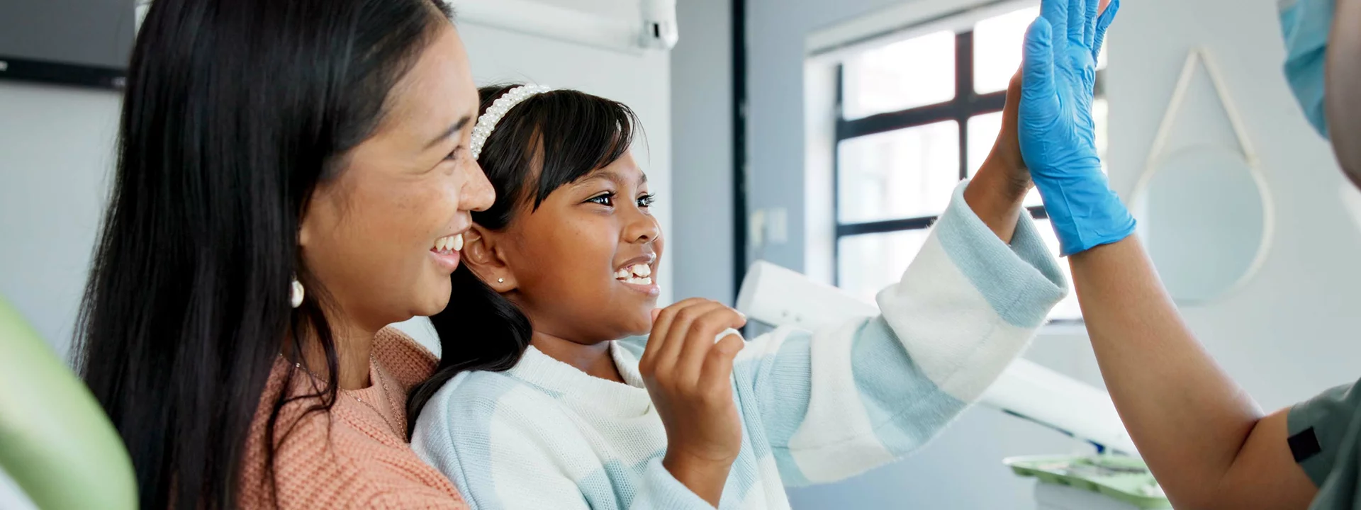 Young girl with her mother at the dentist