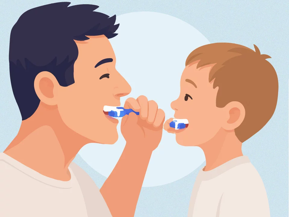 father and son brushing teeth