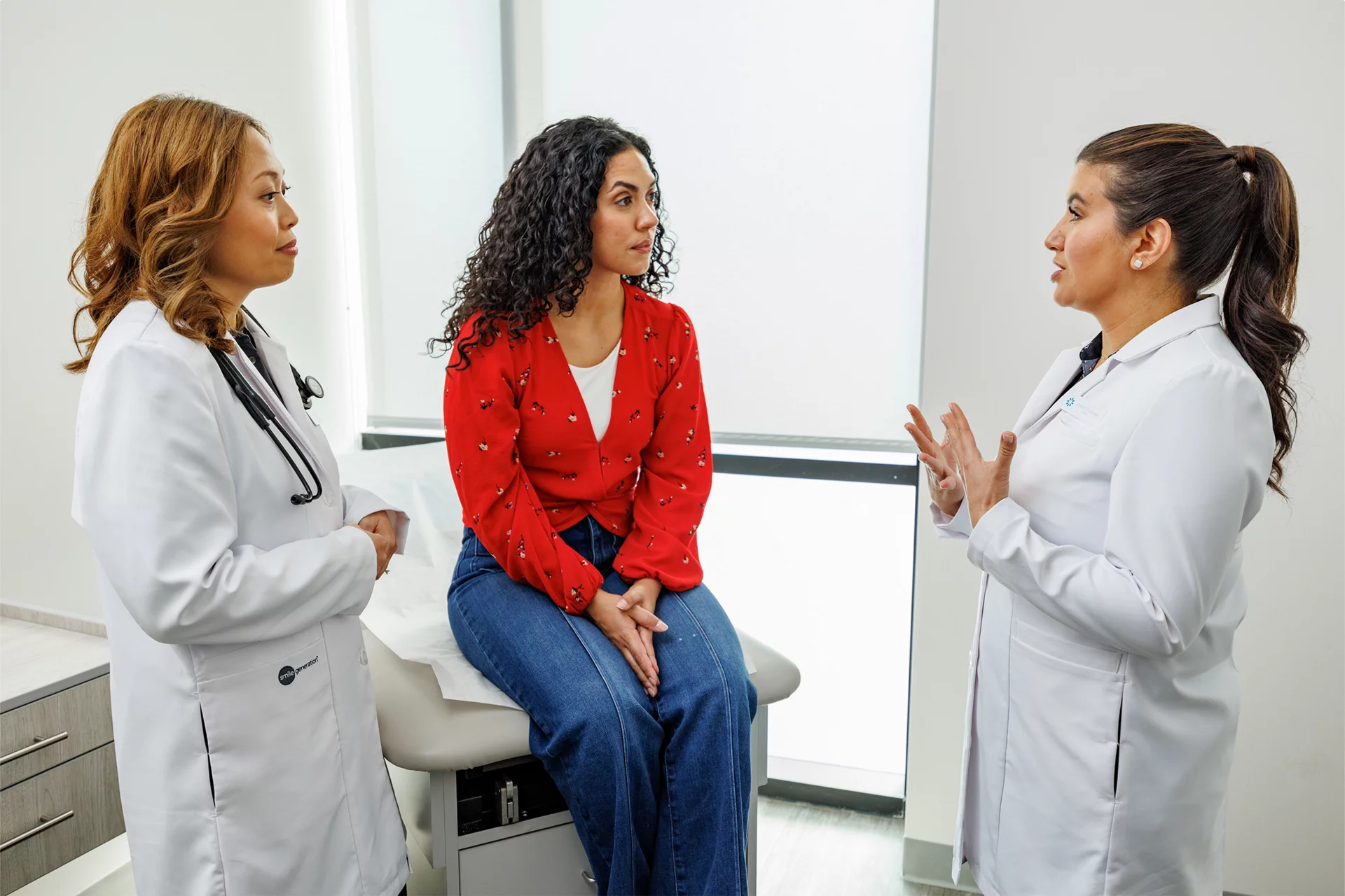 Woman with healthcare providers