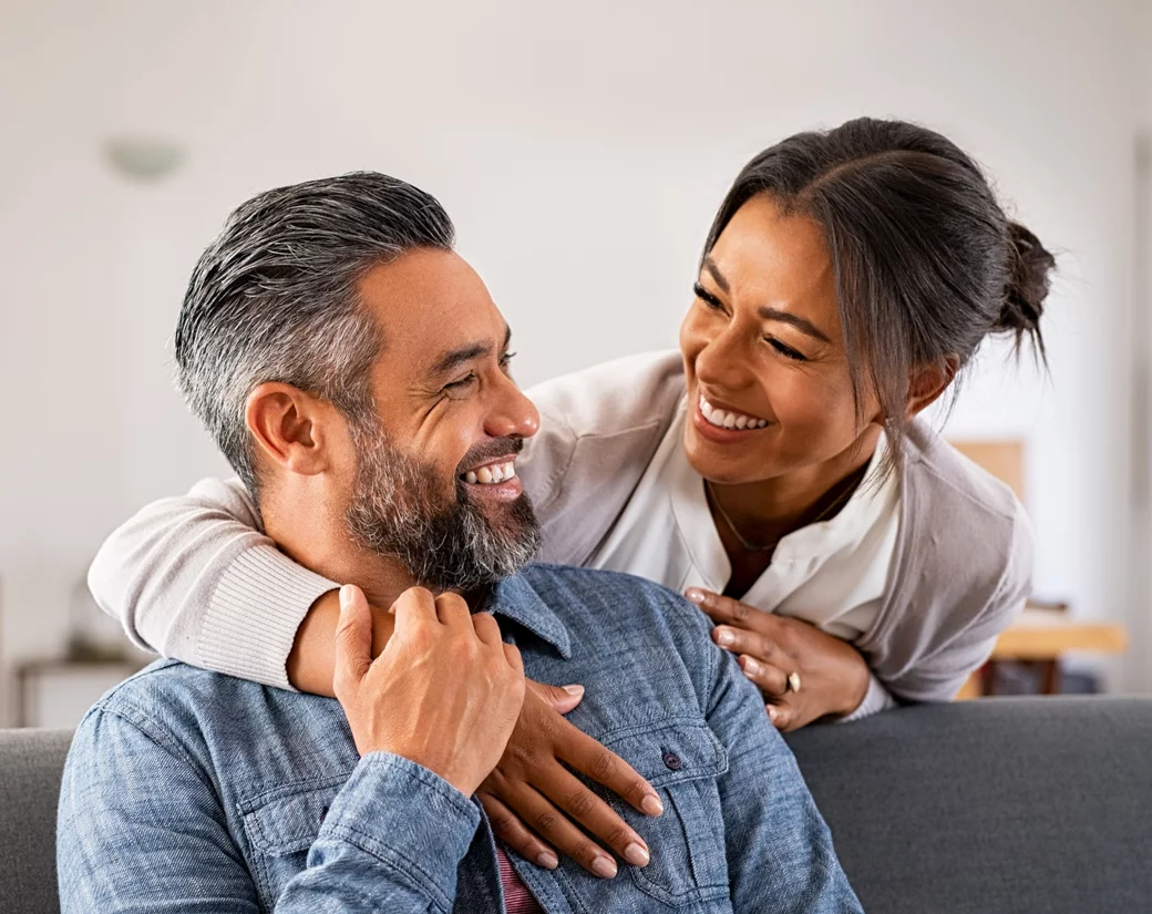 Hispanic couple on couch