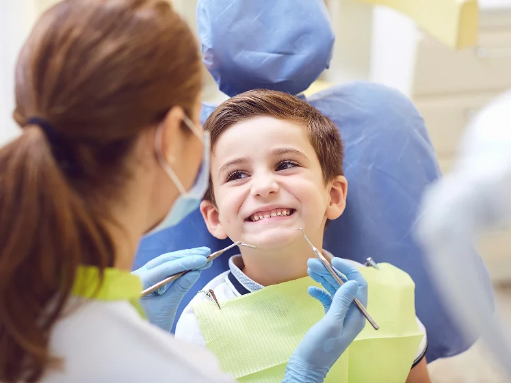 Boy with a big smile at the dentist