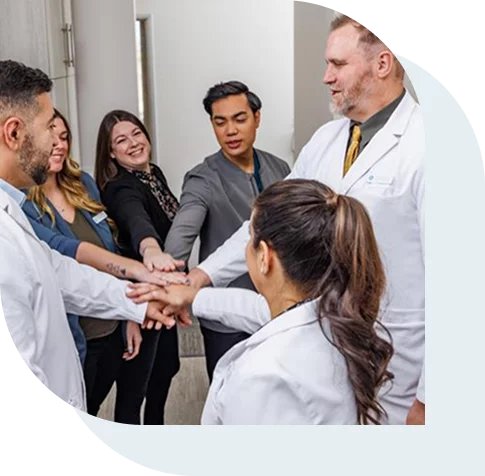 Staff of a dentistry holding morning huddle