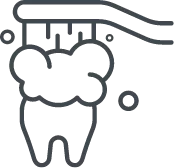a toothbrush brusing the top of a tooth