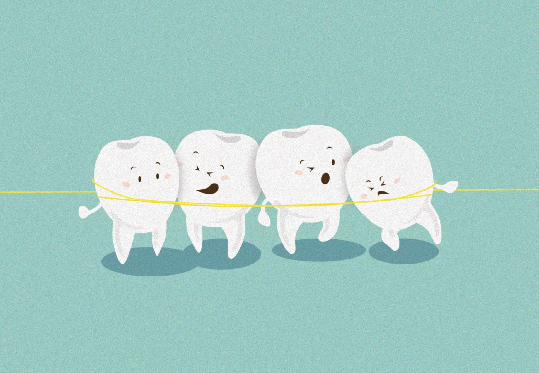 Four Teeth pulled together by yellow floss 