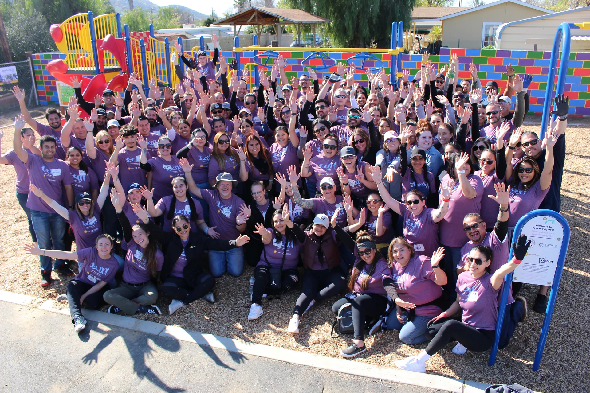 Image of Kaboom playground with group of volunteers smiling