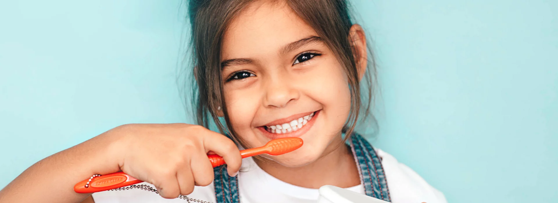 Girl brushing teeth