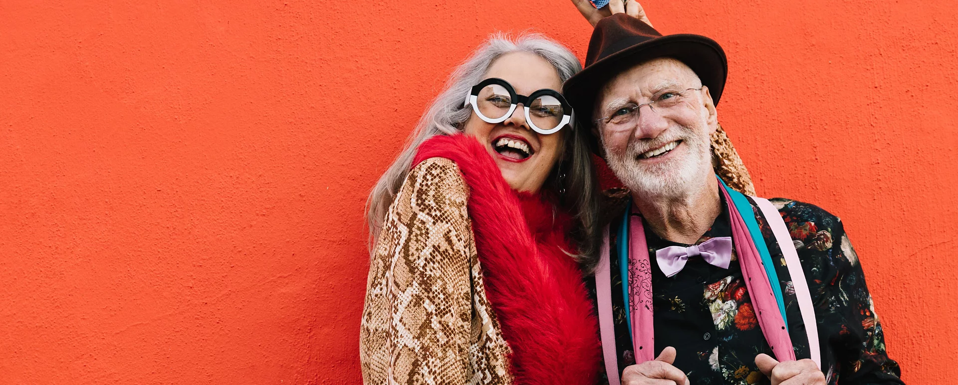 Smiling elderly couple posing for photo