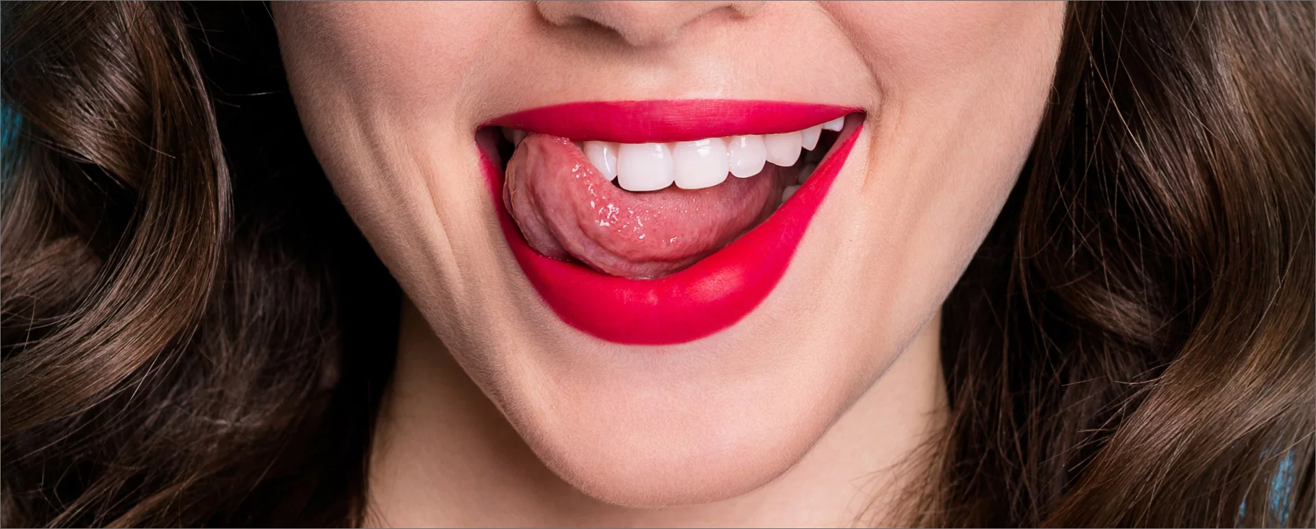 Open smile with tongue licking teeth