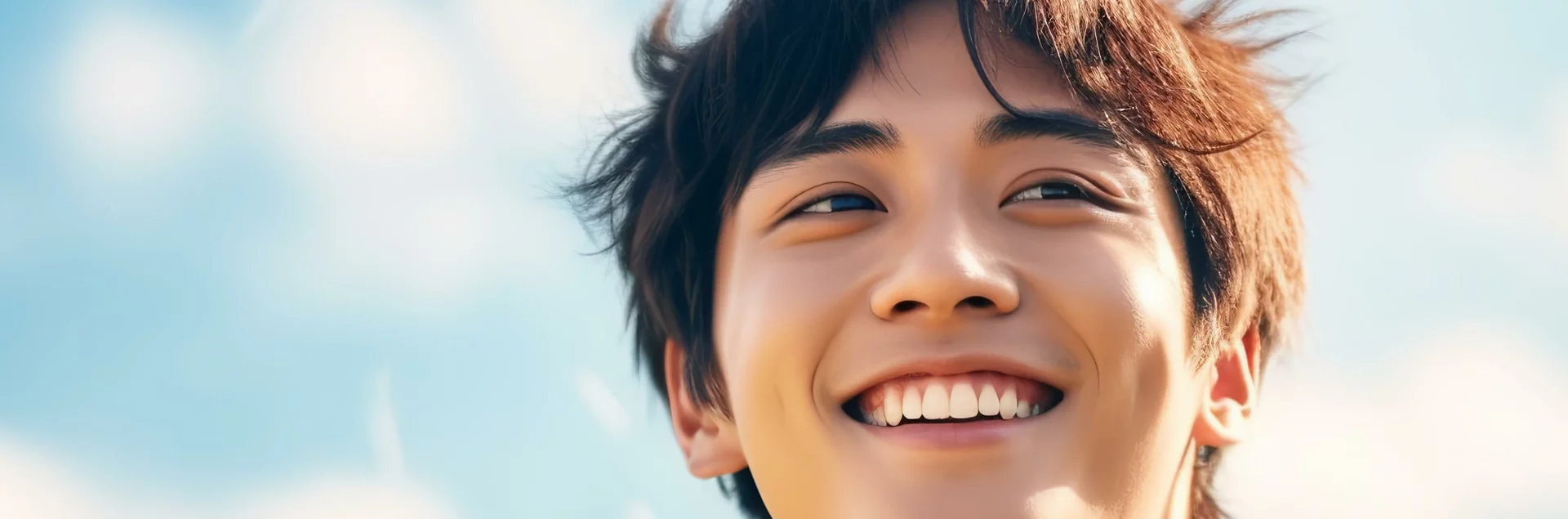 Teenager boy smiling and looking away from the camera photo