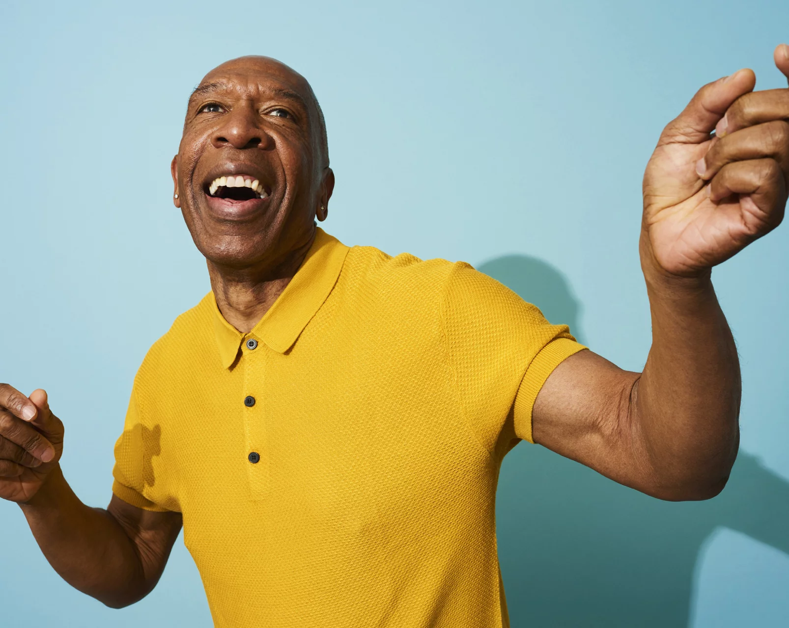 man in yellow shirt