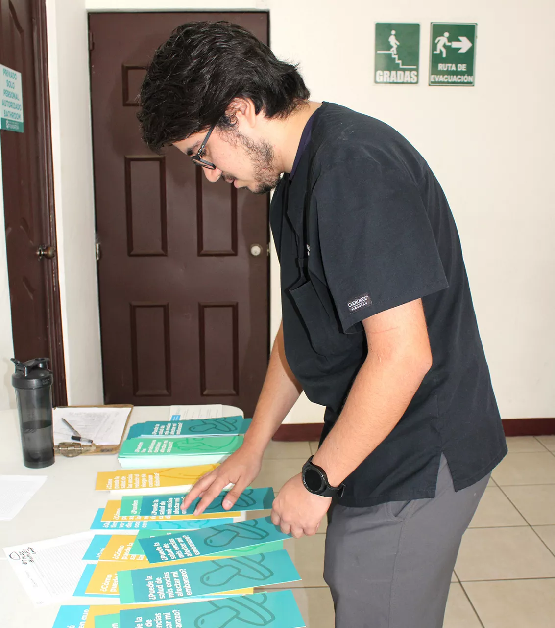 Man looking at flyers