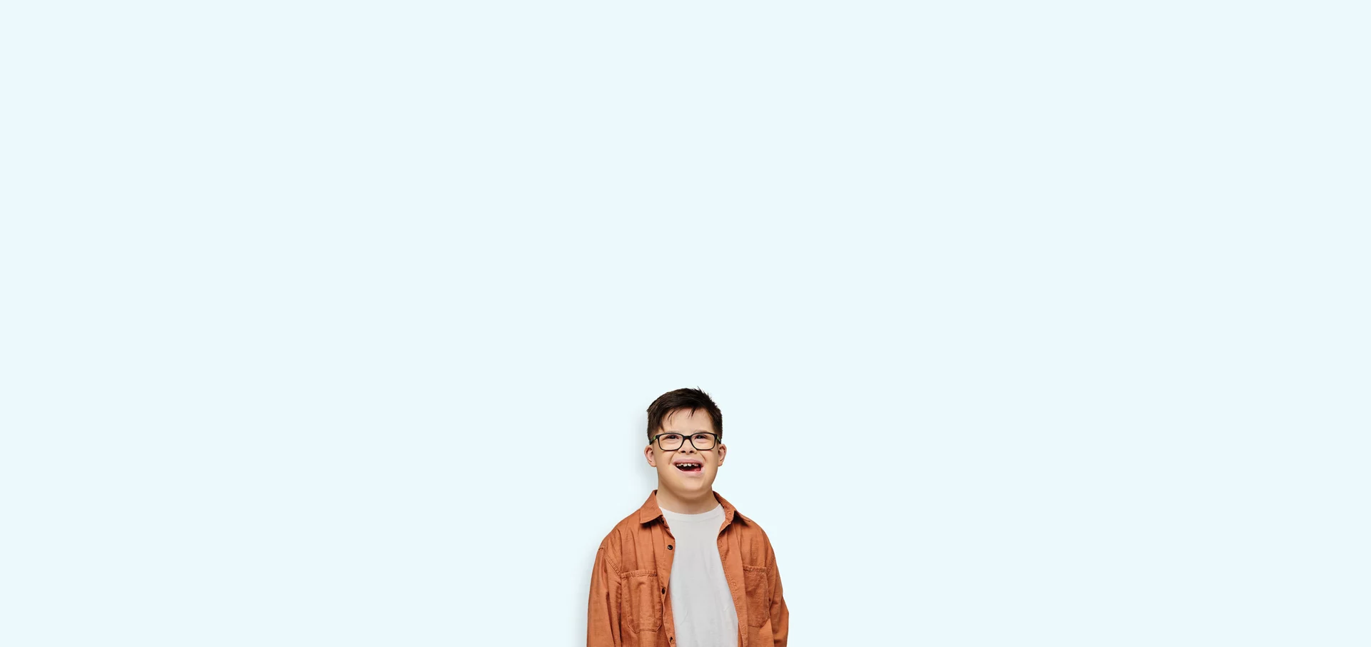 young boy with glasses smiling 