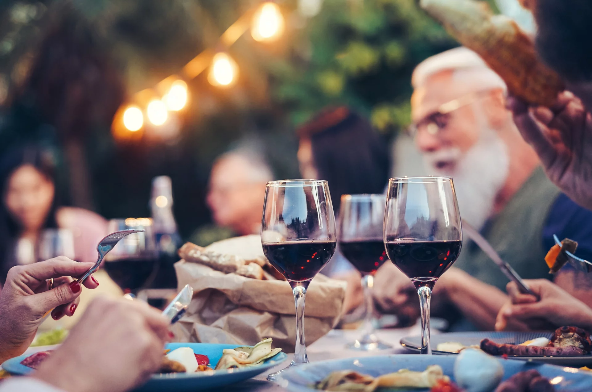 Image of Table of Wine and Food and People