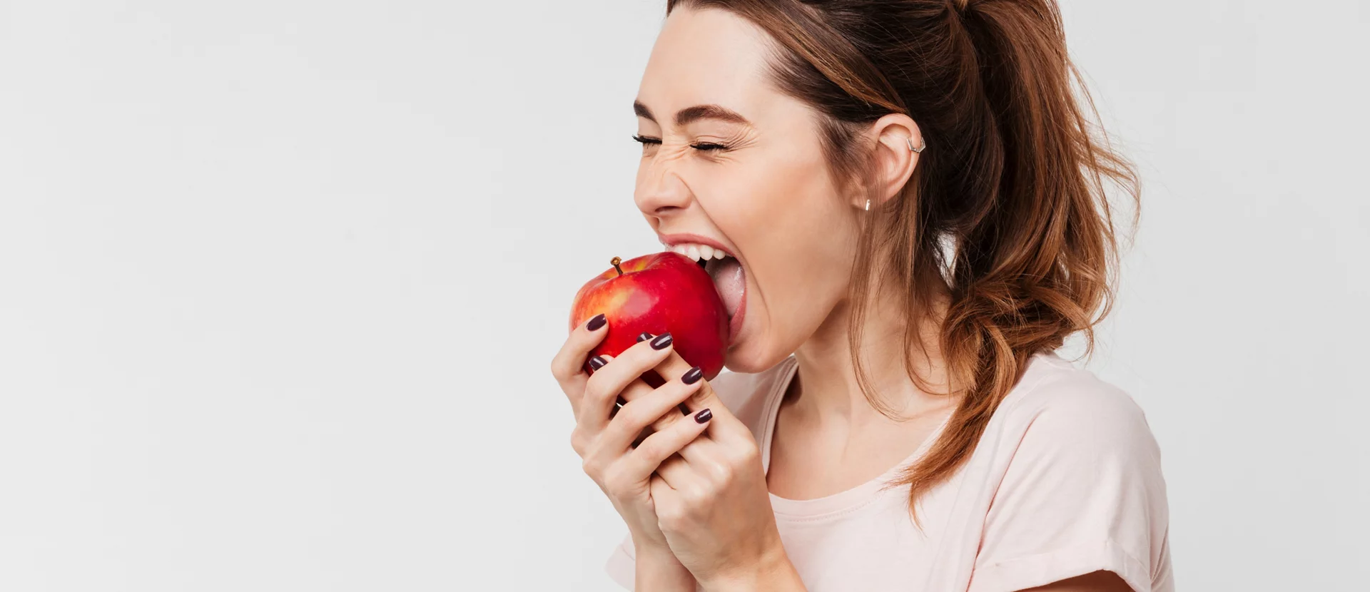 Young lady eating an apple