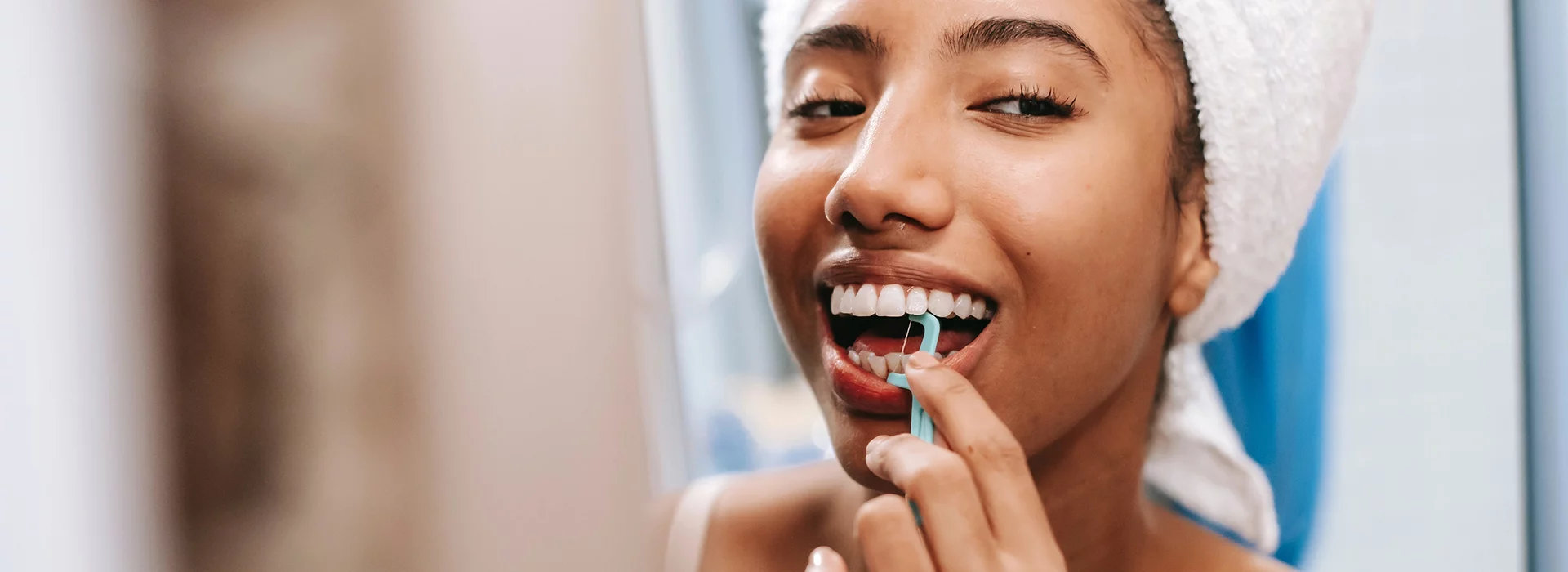 woman with glasses that is smiling.