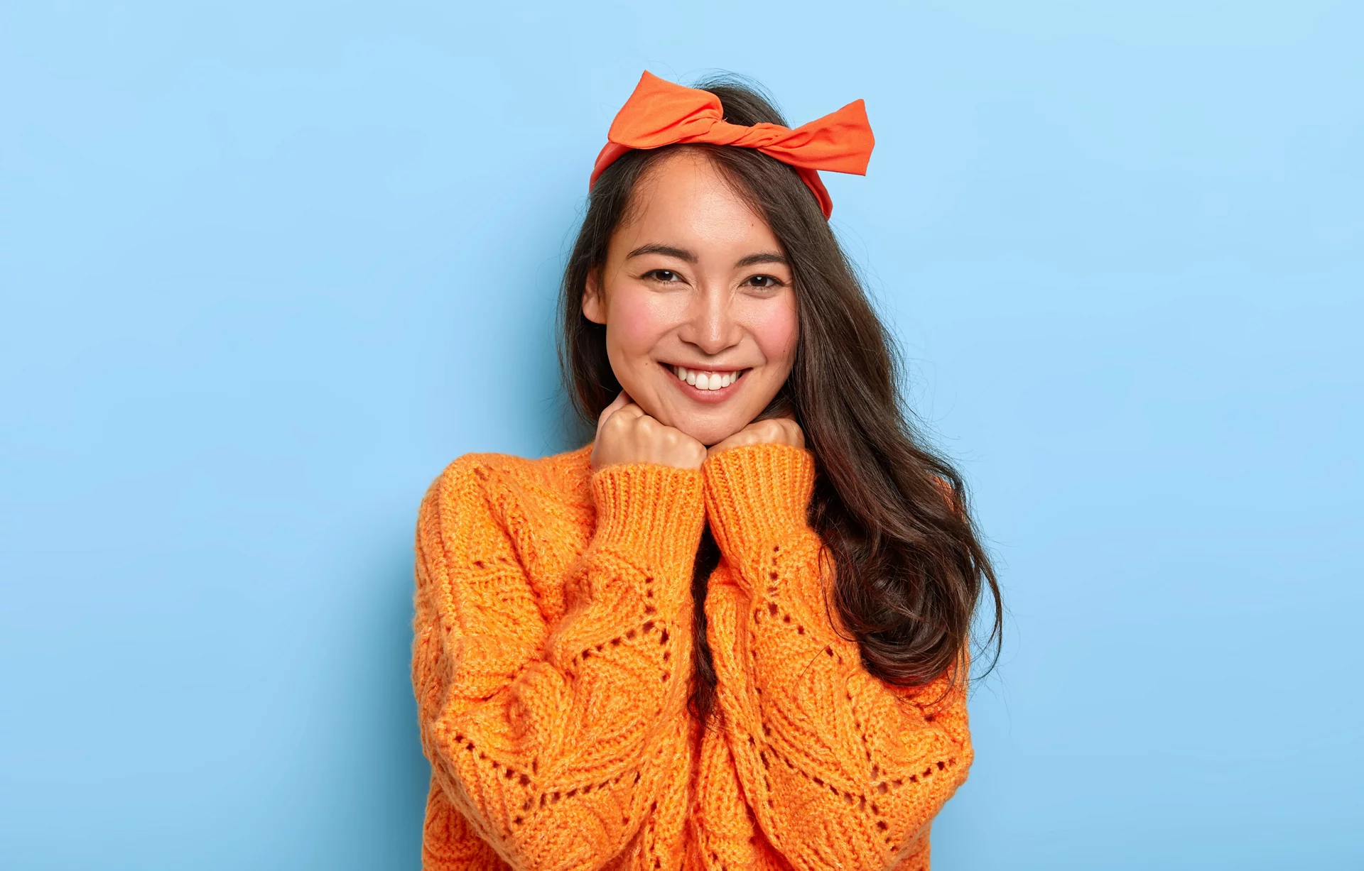 Two individuals hugging and smiling