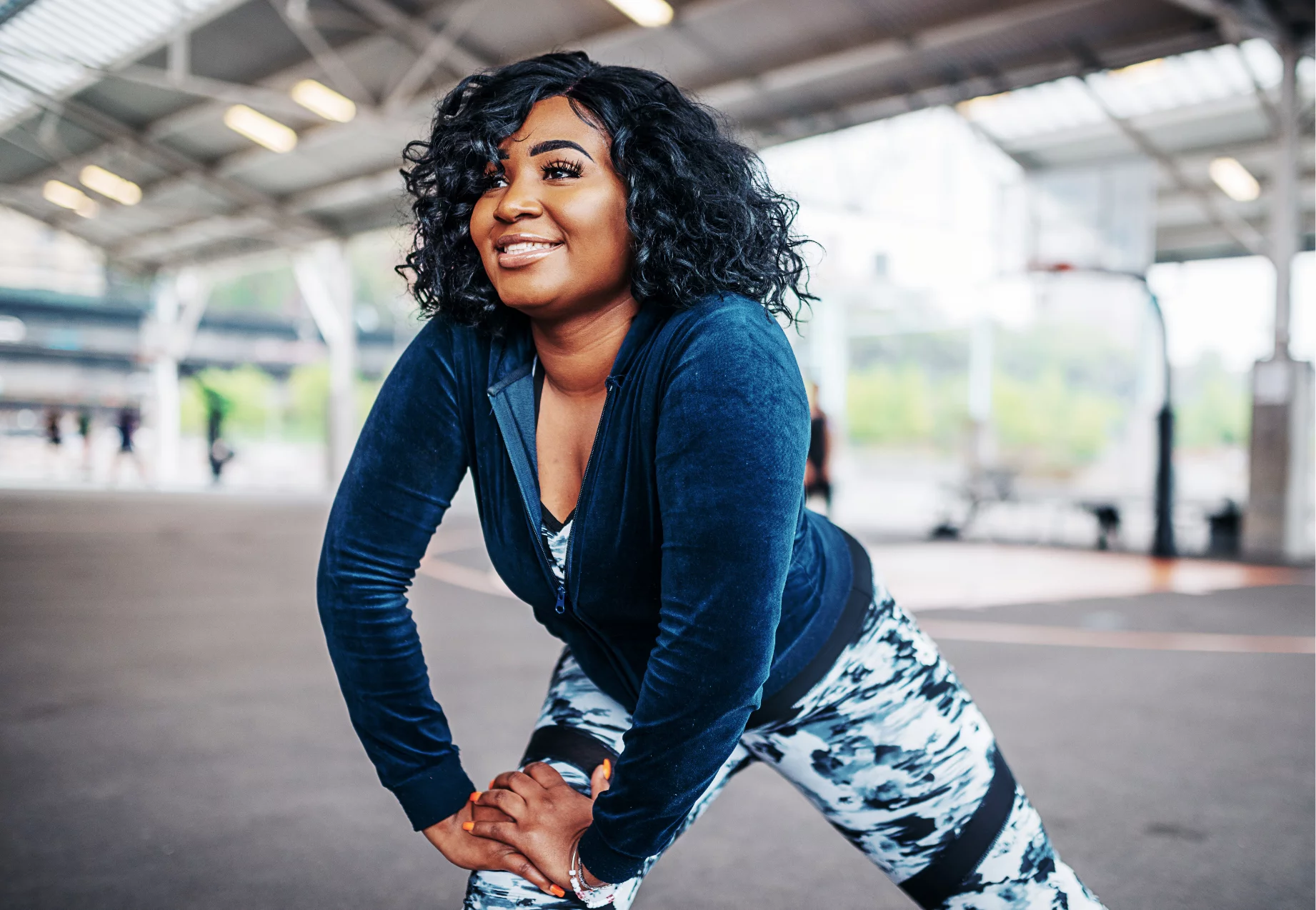 Image of an individual in blue athletic wear stretching