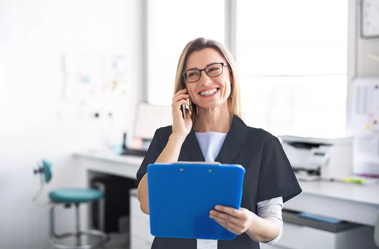 Female dentist on the phone