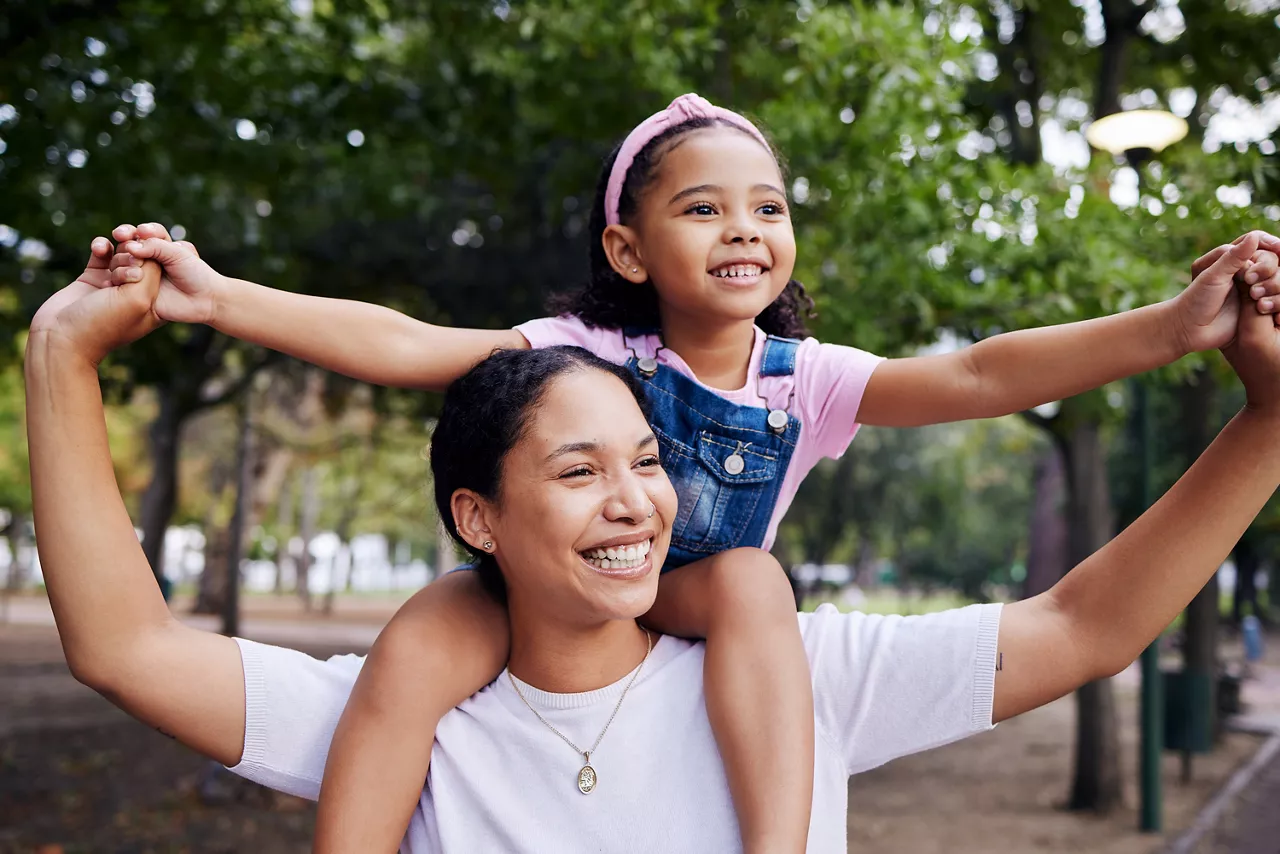 Woman with child on shoulders