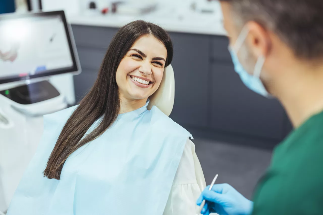 Young woman patient having dental treatment at dentist's office
