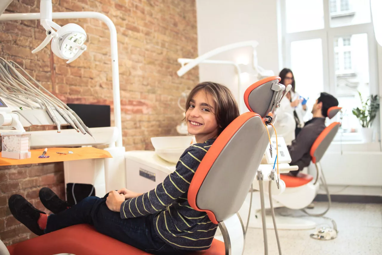 boy in chair at dentist