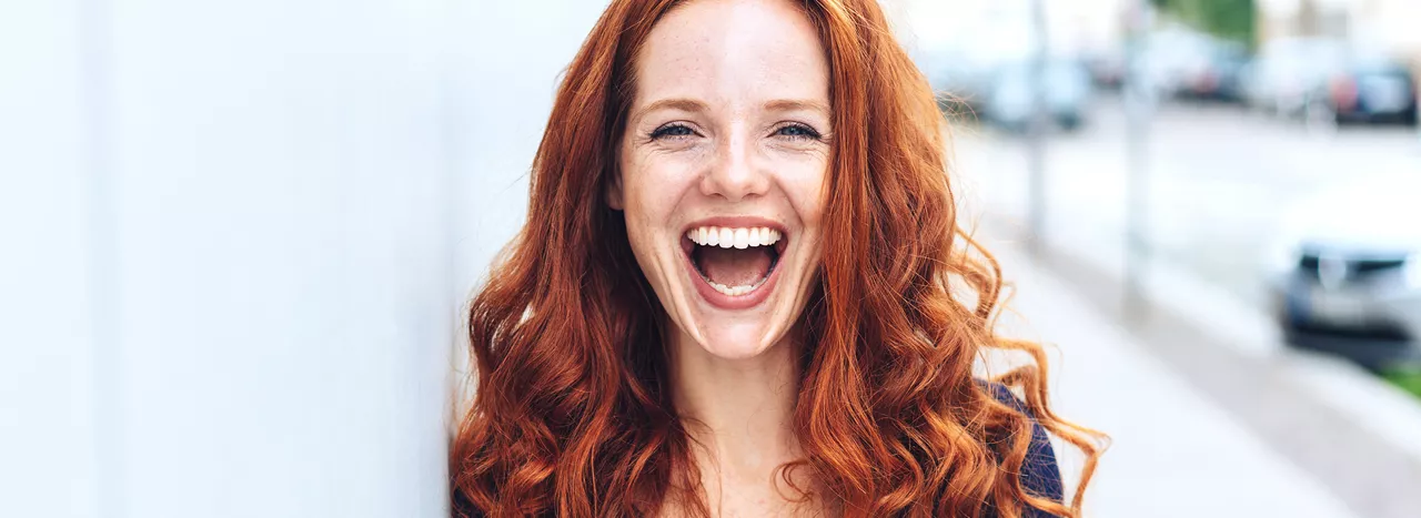 Redhead with big smile