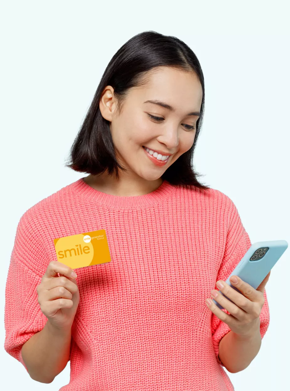 Woman with credit card and phone