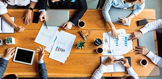 Aerial view of a table with people gathered around it