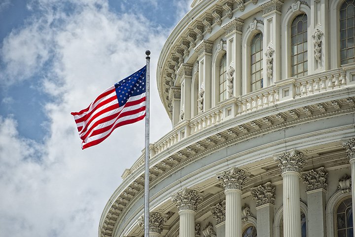 American flag in from of capitol building