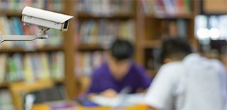 Girl taking notes looking at the device