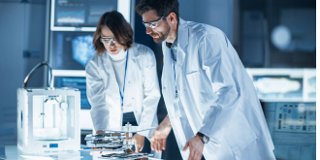 Woman and man engineers in R&D lab