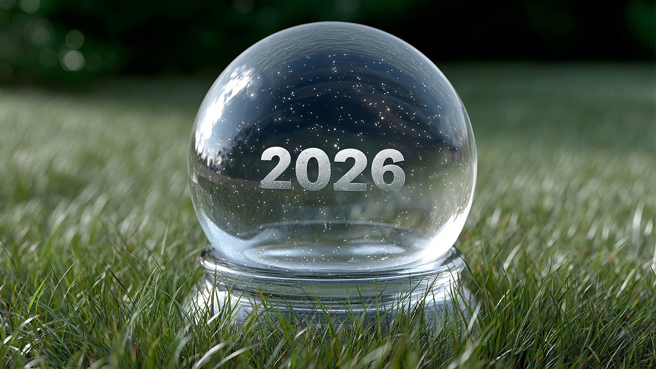 A crystal ball sitting in grass with 2026 inside the crystal ball