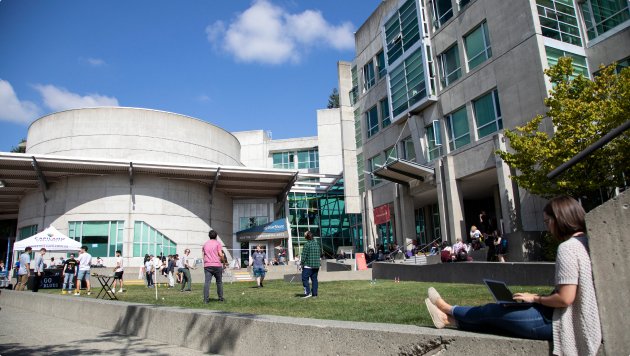 An exterior view of students walking across the capilano university campus