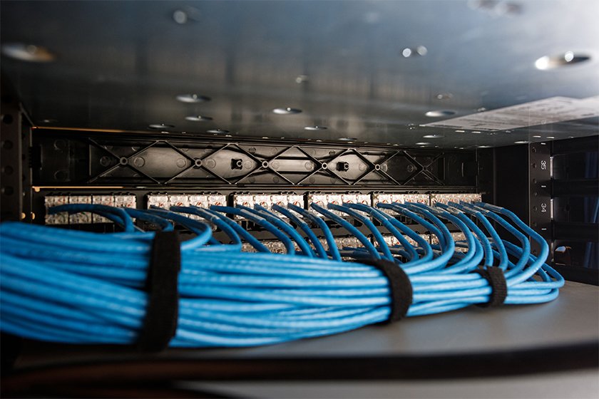 Figure 2: Previous network setup at Capilano University, illustrating disorganized cabling that made troubleshooting and maintenance challenging and time-consuming