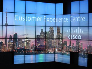 Lighted sign showing a skyline of Toronto and a cisco logo
